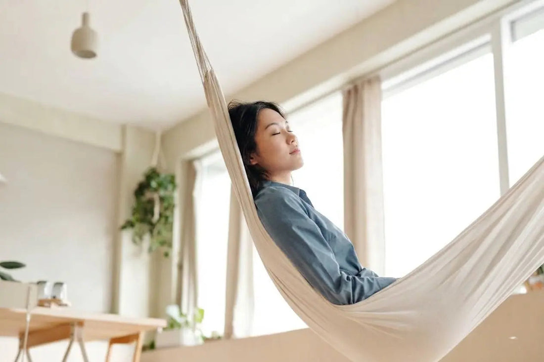 Woman relaxing in a hammock at home after a de-stress ritual with Palo Santo Malaysia | sensmar.com